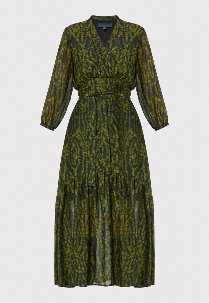 She's back, the best-selling silhouette, Beverly Forest Print Dress, crafted from a luxurious blend of silk and viscose. This midi dress showcases a flattering fit-and-flare silhouette with a crossover V-neckline and a soft belt to accentuate the waist. The voluminous sleeves add a stylish touch, making it an ideal choice for any occasion.