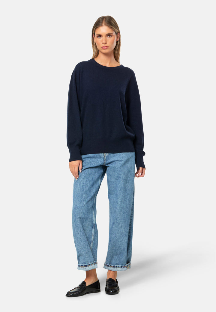 Spun from pure cashmere with a cloud-soft, feather-light handle, it features a neat crew neckline, subtly dropped shoulders and an easy, hip-skimming fit finished with fine rib trims. Effortless on its own with denim, smart layered over a shirt and suiting, and polished with the matching scarf.