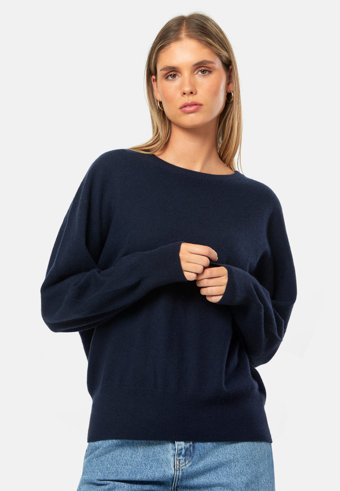 Spun from pure cashmere with a cloud-soft, feather-light handle, it features a neat crew neckline, subtly dropped shoulders and an easy, hip-skimming fit finished with fine rib trims. Effortless on its own with denim, smart layered over a shirt and suiting, and polished with the matching scarf.