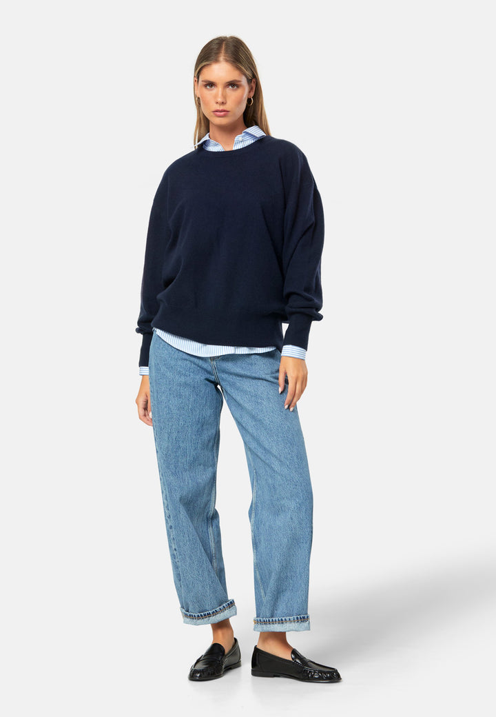 Spun from pure cashmere with a cloud-soft, feather-light handle, it features a neat crew neckline, subtly dropped shoulders and an easy, hip-skimming fit finished with fine rib trims. Effortless on its own with denim, smart layered over a shirt and suiting, and polished with the matching scarf.