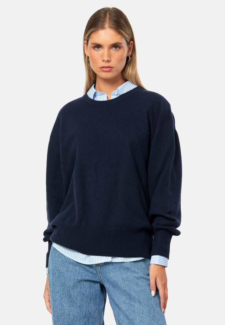 Spun from pure cashmere with a cloud-soft, feather-light handle, it features a neat crew neckline, subtly dropped shoulders and an easy, hip-skimming fit finished with fine rib trims. Effortless on its own with denim, smart layered over a shirt and suiting, and polished with the matching scarf.