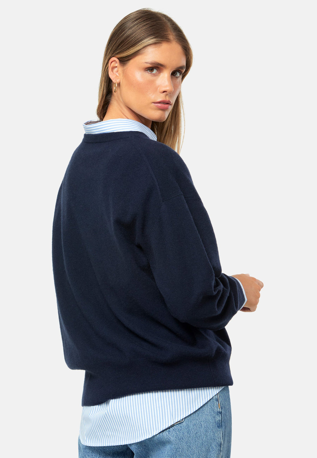 Spun from pure cashmere with a cloud-soft, feather-light handle, it features a neat crew neckline, subtly dropped shoulders and an easy, hip-skimming fit finished with fine rib trims. Effortless on its own with denim, smart layered over a shirt and suiting, and polished with the matching scarf.