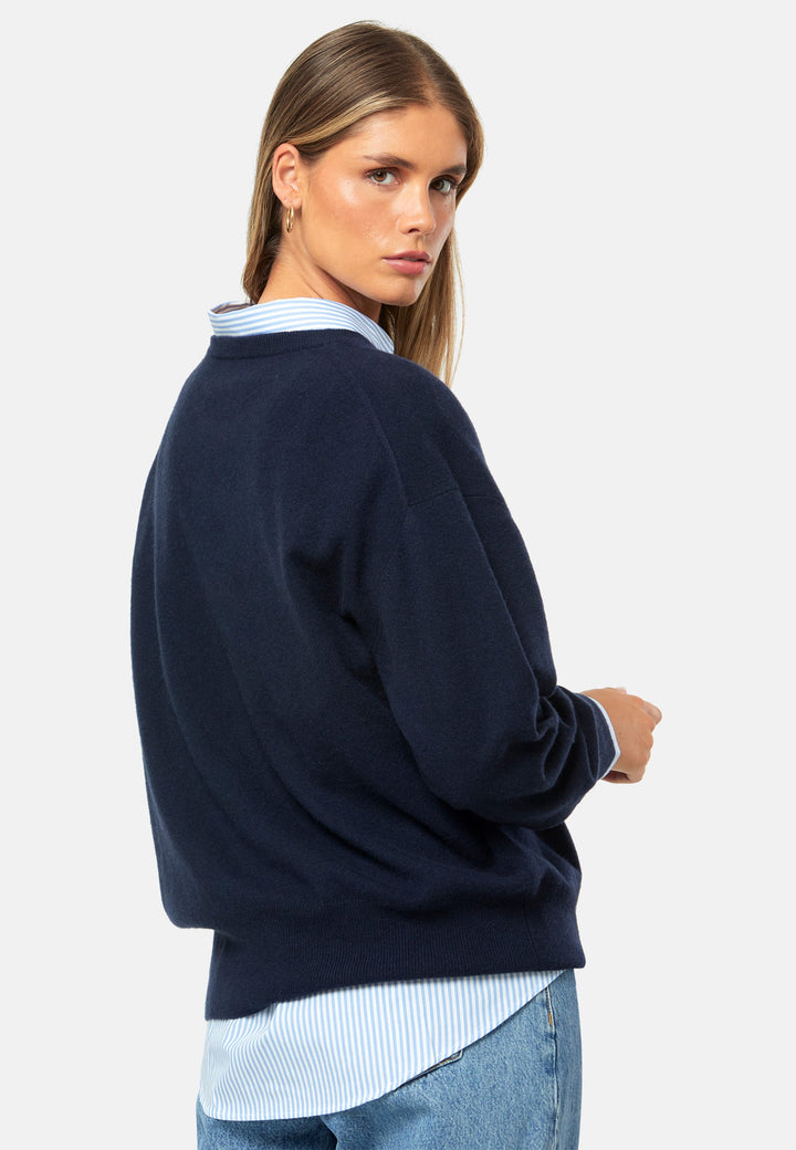 Spun from pure cashmere with a cloud-soft, feather-light handle, it features a neat crew neckline, subtly dropped shoulders and an easy, hip-skimming fit finished with fine rib trims. Effortless on its own with denim, smart layered over a shirt and suiting, and polished with the matching scarf.
