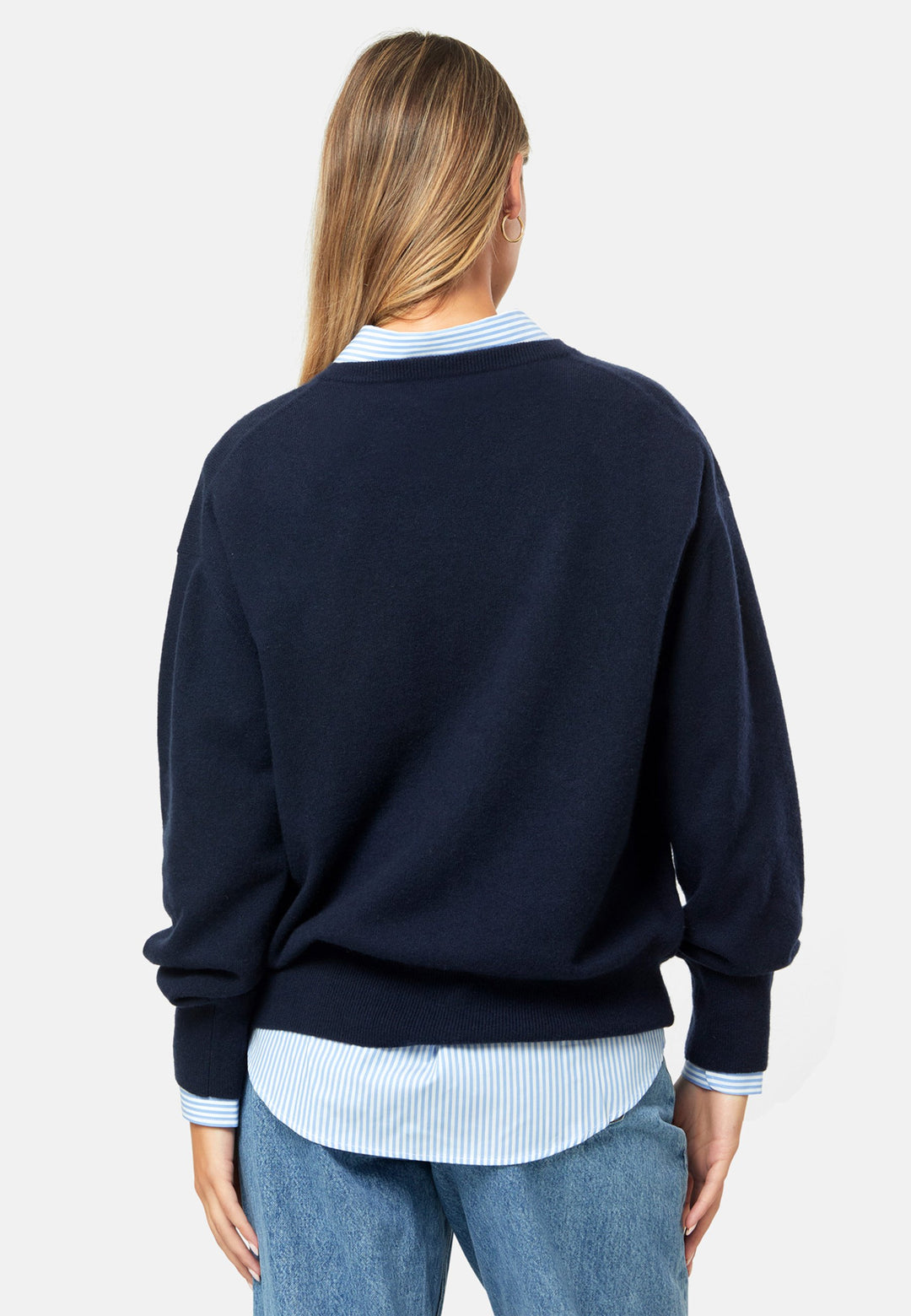 Spun from pure cashmere with a cloud-soft, feather-light handle, it features a neat crew neckline, subtly dropped shoulders and an easy, hip-skimming fit finished with fine rib trims. Effortless on its own with denim, smart layered over a shirt and suiting, and polished with the matching scarf.