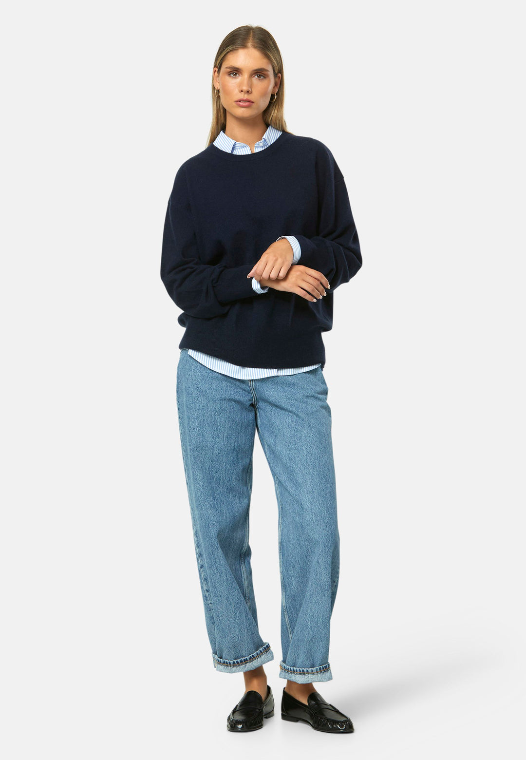 Spun from pure cashmere with a cloud-soft, feather-light handle, it features a neat crew neckline, subtly dropped shoulders and an easy, hip-skimming fit finished with fine rib trims. Effortless on its own with denim, smart layered over a shirt and suiting, and polished with the matching scarf.