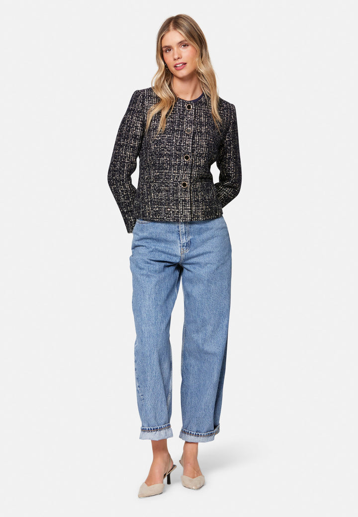 Cassandra, the navy bouclé jacket that pulls everything together. Cut to a neat, waist-defining silhouette with a clean round neckline and long sleeves, it’s woven in textured navy bouclé flecked with light neutrals and burnished metallic threads. Statement gold-rim buttons add polish, while the hip-skimming length makes it effortless over dresses, denim or tailoring. Style with the Lyra or Georgina trousers for a modern suit, or throw on with a tee for off-duty chic.