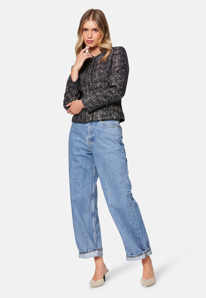Cassandra, the navy bouclé jacket that pulls everything together. Cut to a neat, waist-defining silhouette with a clean round neckline and long sleeves, it’s woven in textured navy bouclé flecked with light neutrals and burnished metallic threads. Statement gold-rim buttons add polish, while the hip-skimming length makes it effortless over dresses, denim or tailoring. Style with the Lyra or Georgina trousers for a modern suit, or throw on with a tee for off-duty chic.