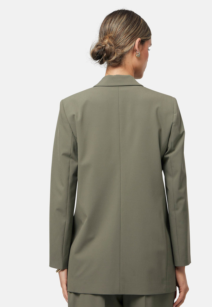 The Cassie Olive boyfriend jacket offers a modern twist on classic tailoring. This sleek, single-button jacket features a relaxed fit, notched lapels, and functional front pockets. Perfect for layering over both casual and formal outfits for a polished look. Pair with the matching Lyra olive trousers to elevate your work wardrobe.