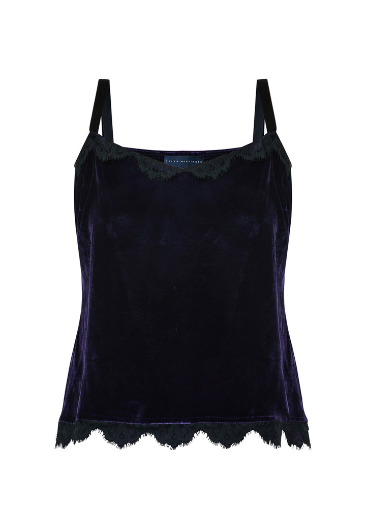 Crafted from a viscose and silk blend with a hint of stretch, the Cleo Velvet Cami in twilight plum features delicate black lace trim on the neckline and hem, complemented by black velvet straps. Pair with the matching velvet suit for a full glam winter look or style with a simple tailored tux for understated elegance.
