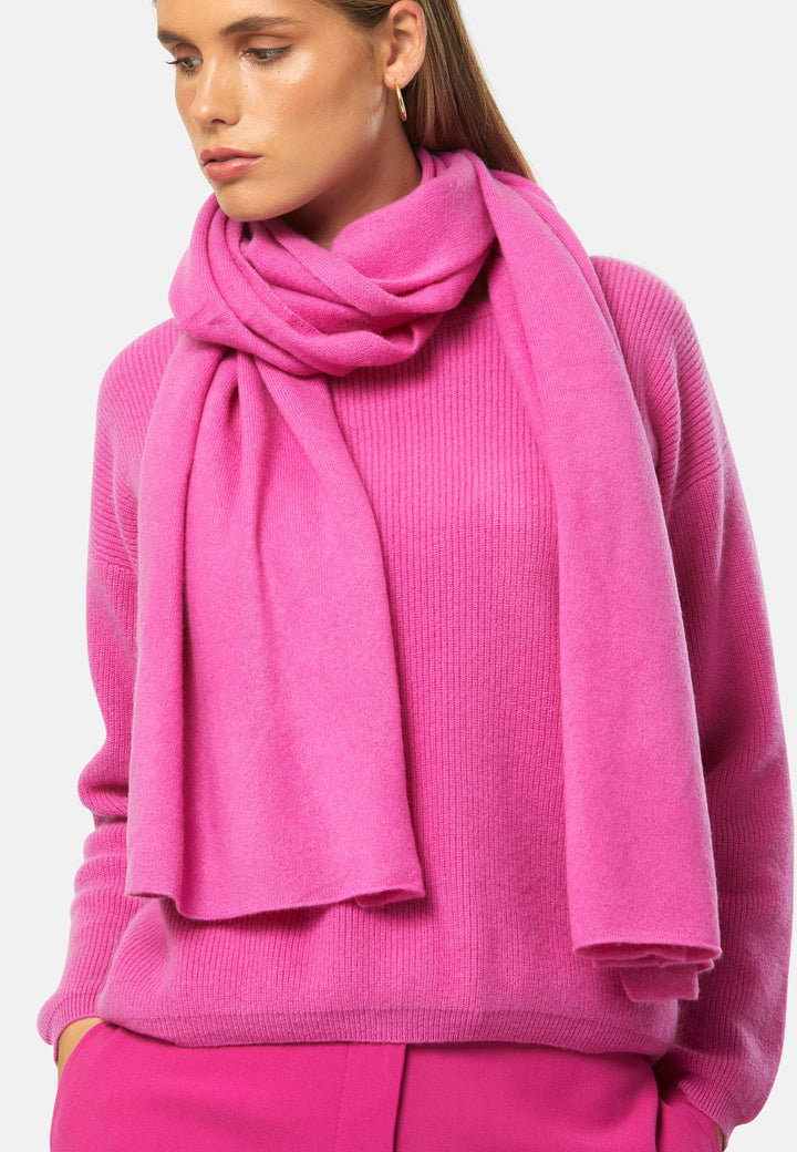 Knitted in pure cashmere with a soft handle, this generously cut wrap drapes fluidly. Loop, wrap or wear as a shoulder cover-up. It’s the easiest way to add colour to winter dressing. Pair with coordinating cashmere for a polished monotone look.