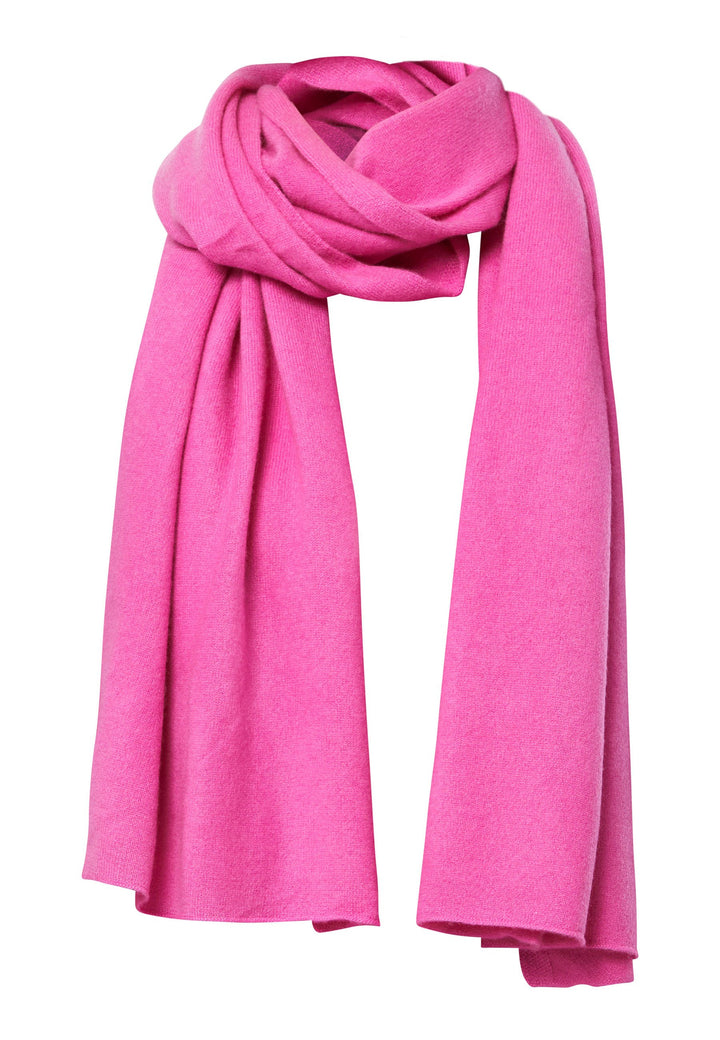 Knitted in pure cashmere with a soft handle, this generously cut wrap drapes fluidly. Loop, wrap or wear as a shoulder cover-up. It’s the easiest way to add colour to winter dressing. Pair with coordinating cashmere for a polished monotone look.