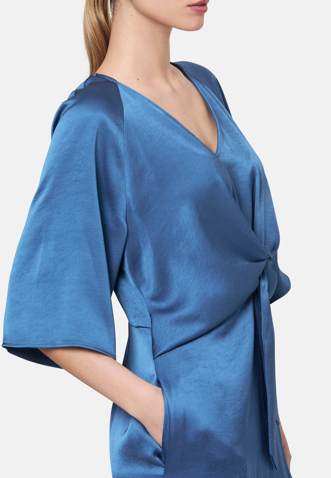 Woman wearing silk-touch satin in storm blue dress