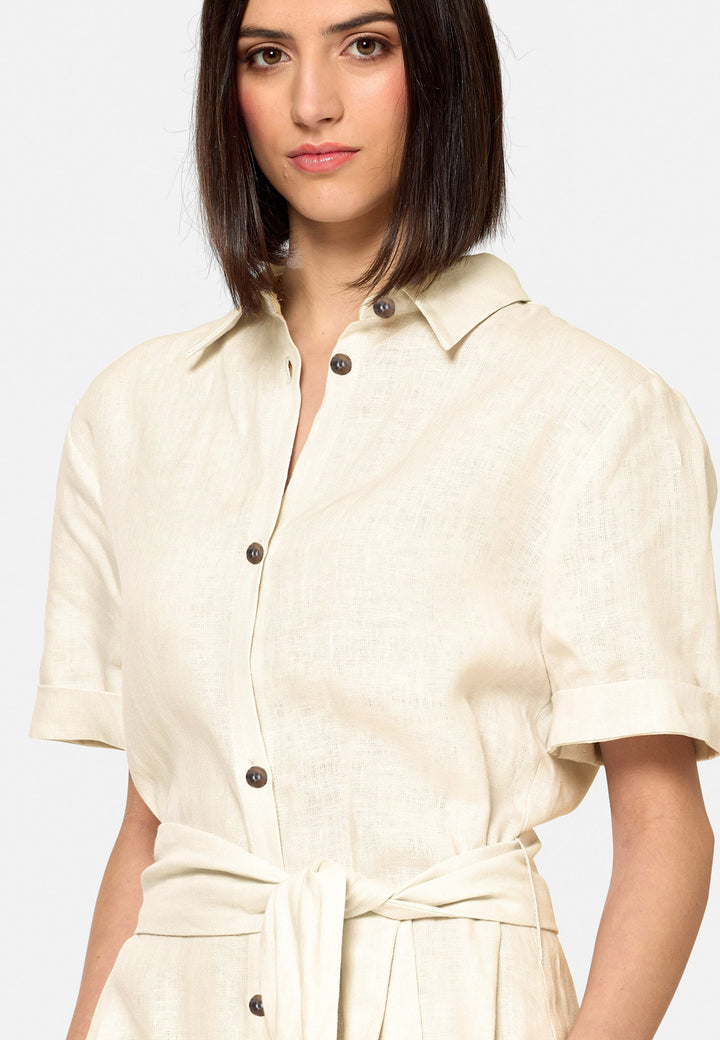 Bella, a relaxed Ecru shirt dress, offers effortless style with its button-down front, short T-shirt length sleeves, and curved hem. Crafted from breathable Baird McNuit Irish linen fabric, it’s perfect for warm-weather days. It combines comfort and versatility, making it a great choice for casual outings or laid-back weekends.