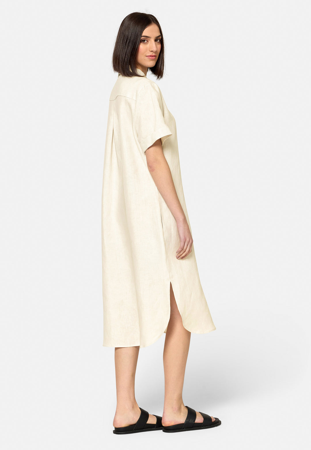 Bella, a relaxed Ecru shirt dress, offers effortless style with its button-down front, short T-shirt length sleeves, and curved hem. Crafted from breathable Baird McNuit Irish linen fabric, it’s perfect for warm-weather days. It combines comfort and versatility, making it a great choice for casual outings or laid-back weekends.