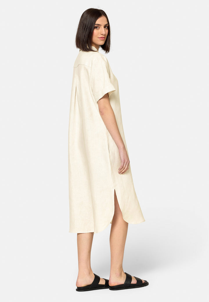 Bella, a relaxed Ecru shirt dress, offers effortless style with its button-down front, short T-shirt length sleeves, and curved hem. Crafted from breathable Baird McNuit Irish linen fabric, it’s perfect for warm-weather days. It combines comfort and versatility, making it a great choice for casual outings or laid-back weekends.