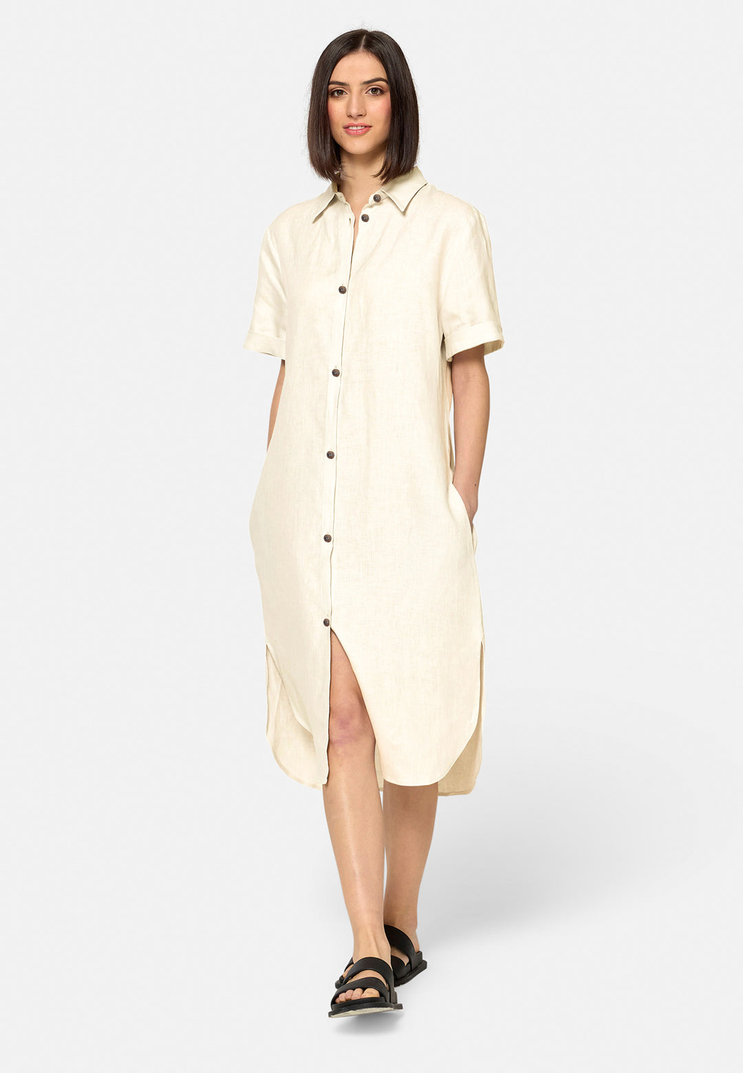 Bella, a relaxed Ecru shirt dress, offers effortless style with its button-down front, short T-shirt length sleeves, and curved hem. Crafted from breathable Baird McNuit Irish linen fabric, it’s perfect for warm-weather days. It combines comfort and versatility, making it a great choice for casual outings or laid-back weekends.