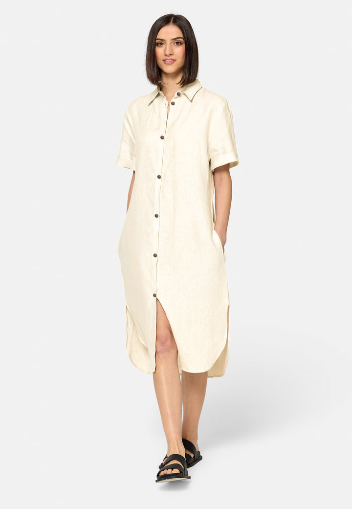 Bella, a relaxed Ecru shirt dress, offers effortless style with its button-down front, short T-shirt length sleeves, and curved hem. Crafted from breathable Baird McNuit Irish linen fabric, it’s perfect for warm-weather days. It combines comfort and versatility, making it a great choice for casual outings or laid-back weekends.