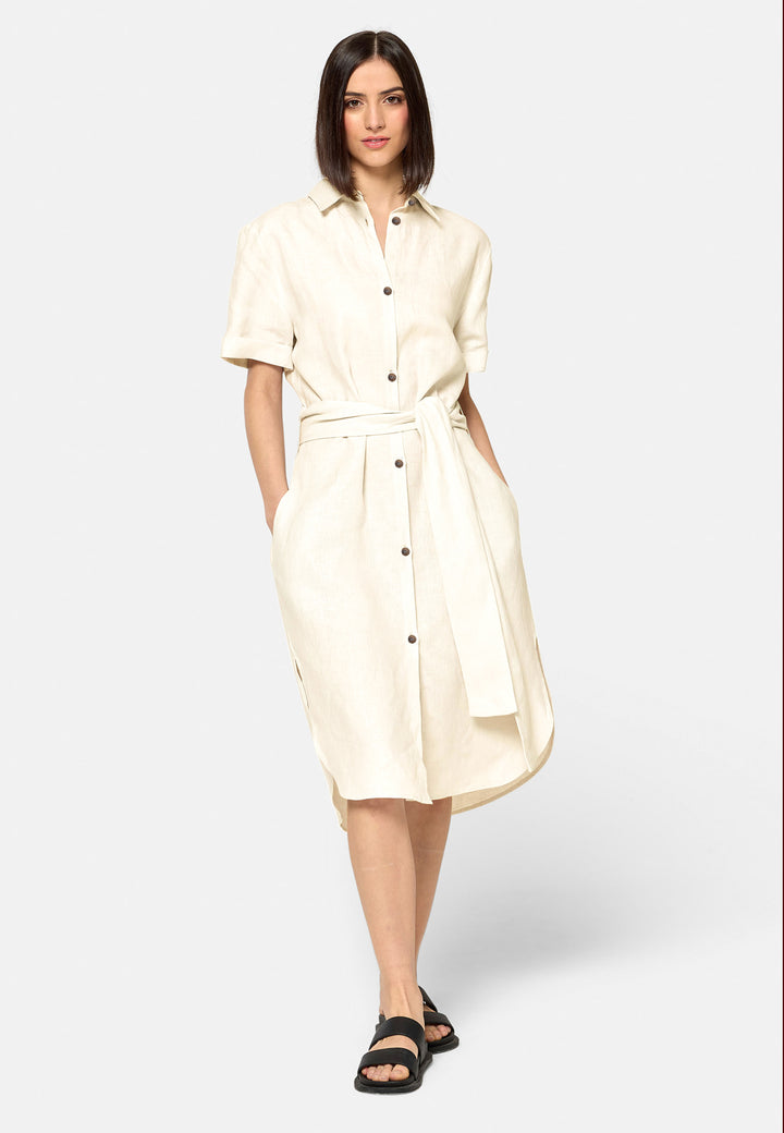 Bella, a relaxed Ecru shirt dress, offers effortless style with its button-down front, short T-shirt length sleeves, and curved hem. Crafted from breathable Baird McNuit Irish linen fabric, it’s perfect for warm-weather days. It combines comfort and versatility, making it a great choice for casual outings or laid-back weekends.