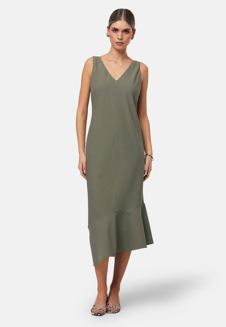Dylan is a sleeveless midi dress featuring a clean, minimalist silhouette with a V-neckline and a soft, flared hemline for subtle movement. The back showcases an elegant bow detail that adds a touch of visual interest. Made from a smooth, lightweight fabric cut on its bias, the dress ensures comfort and versatility for both casual and formal occasions. Pair it with heels or flats for effortless styling.