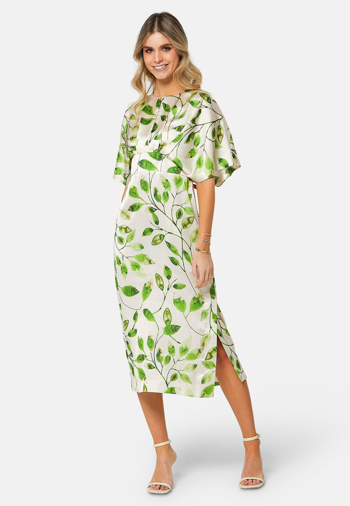 A captivating piece that seamlessly blends nature-inspired charm with sophisticated elegance. Featuring a delicate leafy print against a neutral backdrop, this dress captures the essence of serene beauty. Crafted from draped satin, it offers a luxurious feel with a graceful flow that complements its design. 