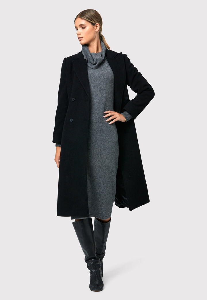 Have you met the Elora Charcoal Grey Cashmere Dress? A chic and versatile addition to your wardrobe. This midi-length dress features a loose, drapey polo neck, exuding effortless elegance. With full-length sleeves and tight ribbed cuffs, it offers a stylish yet comfortable fit. Crafted from luxurious cashmere, this dress effortlessly combines sophistication and comfort, making it the perfect go-to piece for any occasion.