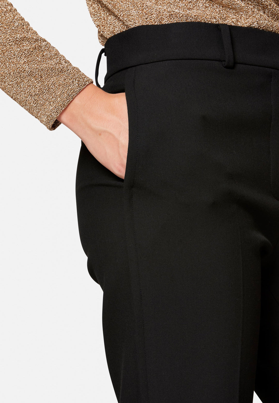 Cut from our signature tricotine with a hint of stretch, they sit neatly at the waist with a clean waistband, belt loops and concealed fastening. Pressed creases sharpen the narrow leg to an ankle-skimming finish, while side pockets keep them practical. Pair with the coordinating silk shirt for polish, or a crisp white tee for ease.