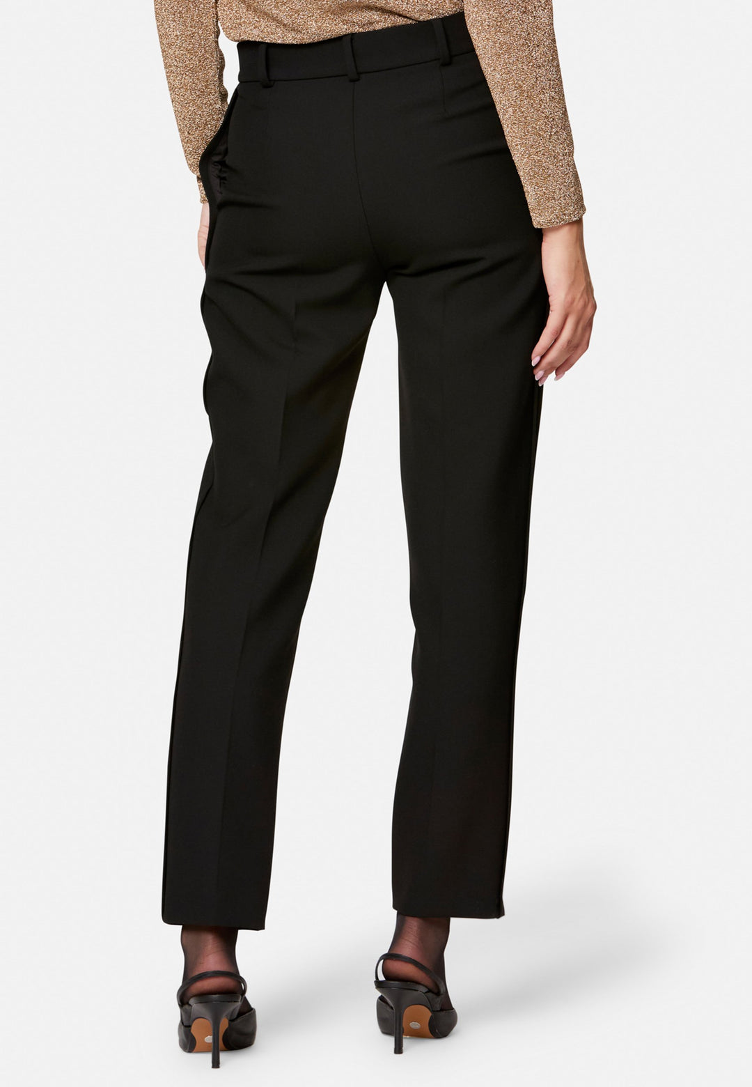Cut from our signature tricotine with a hint of stretch, they sit neatly at the waist with a clean waistband, belt loops and concealed fastening. Pressed creases sharpen the narrow leg to an ankle-skimming finish, while side pockets keep them practical. Pair with the coordinating silk shirt for polish, or a crisp white tee for ease.
