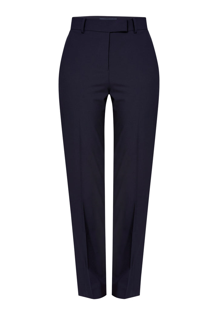Georgiana, the tailored slim trouser. Cut in worsted navy bi-stretch suiting, it sits on the natural waist with a gently tapered leg falling to a neat ankle length. Finished with pressed creases, belt loops, side seam pockets and back welt pockets. Wear with the Darcie blazer for the coordinating suit, and style with the Anastasia pussy-bow blouse.