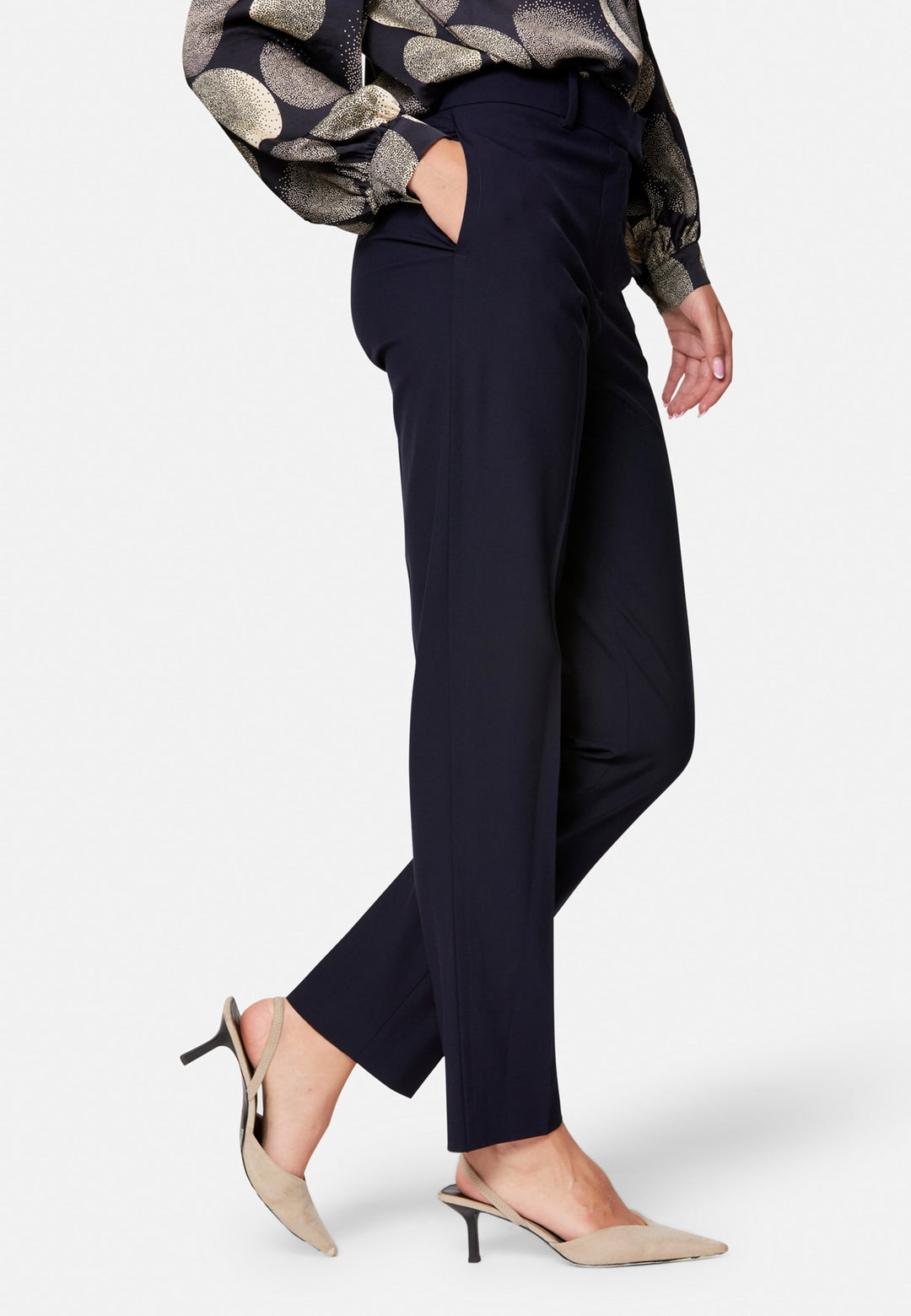 Georgiana, the tailored slim trouser. Cut in worsted navy bi-stretch suiting, it sits on the natural waist with a gently tapered leg falling to a neat ankle length. Finished with pressed creases, belt loops, side seam pockets and back welt pockets. Wear with the Darcie blazer for the coordinating suit, and style with the Anastasia pussy-bow blouse.