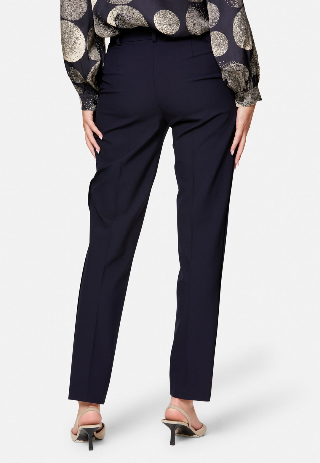 Georgiana, the tailored slim trouser. Cut in worsted navy bi-stretch suiting, it sits on the natural waist with a gently tapered leg falling to a neat ankle length. Finished with pressed creases, belt loops, side seam pockets and back welt pockets. Wear with the Darcie blazer for the coordinating suit, and style with the Anastasia pussy-bow blouse.