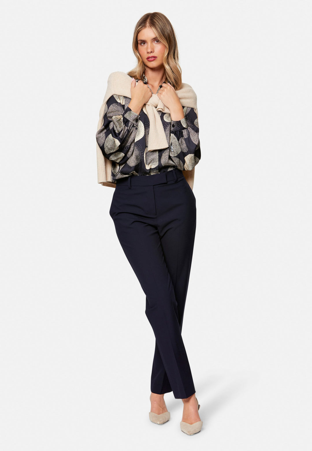 Georgiana, the tailored slim trouser. Cut in worsted navy bi-stretch suiting, it sits on the natural waist with a gently tapered leg falling to a neat ankle length. Finished with pressed creases, belt loops, side seam pockets and back welt pockets. Wear with the Darcie blazer for the coordinating suit, and style with the Anastasia pussy-bow blouse.