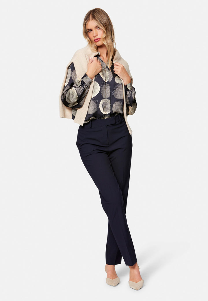 Georgiana, the tailored slim trouser. Cut in worsted navy bi-stretch suiting, it sits on the natural waist with a gently tapered leg falling to a neat ankle length. Finished with pressed creases, belt loops, side seam pockets and back welt pockets. Wear with the Darcie blazer for the coordinating suit, and style with the Anastasia pussy-bow blouse.