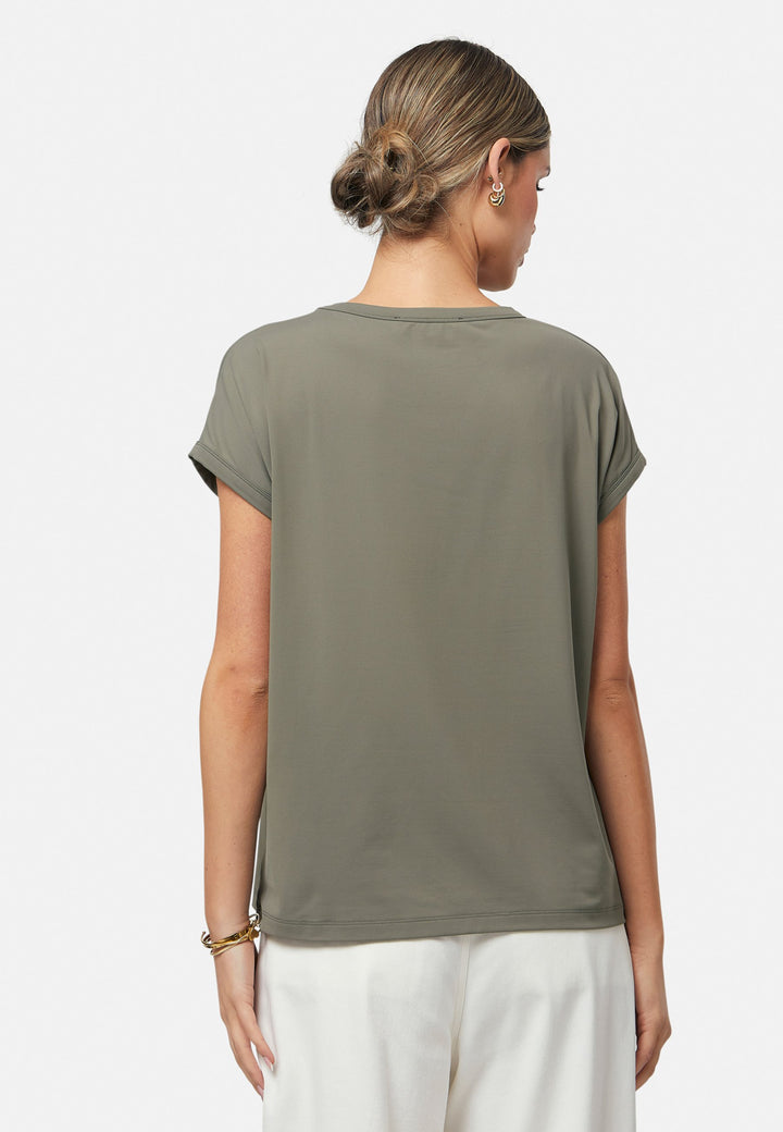Gina, a fluid T-shirt with a clean crew neck. This loose silhouette is made to be worn oversized. Fabricated in a luxe stretch jersey. This style features in our soft olive collection, pairing perfectly with our Lyra Pant and Cassie Jacket for a monochrome moment.