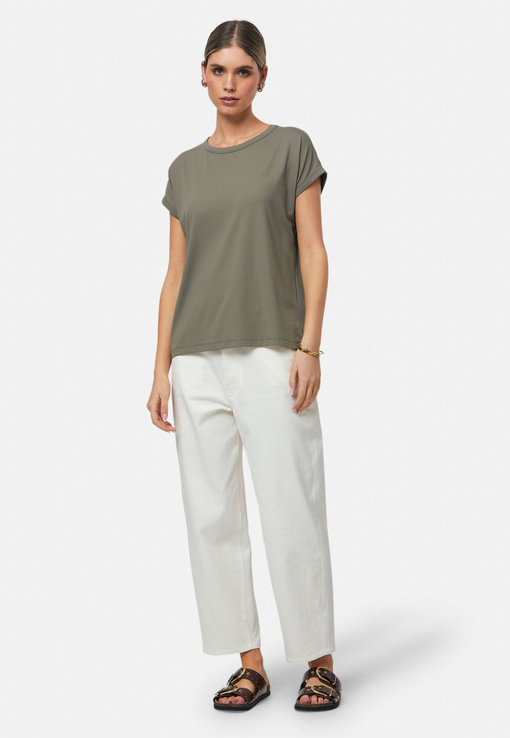 Gina, a fluid T-shirt with a clean crew neck. This loose silhouette is made to be worn oversized. Fabricated in a luxe stretch jersey. This style features in our soft olive collection, pairing perfectly with our Lyra Pant and Cassie Jacket for a monochrome moment.