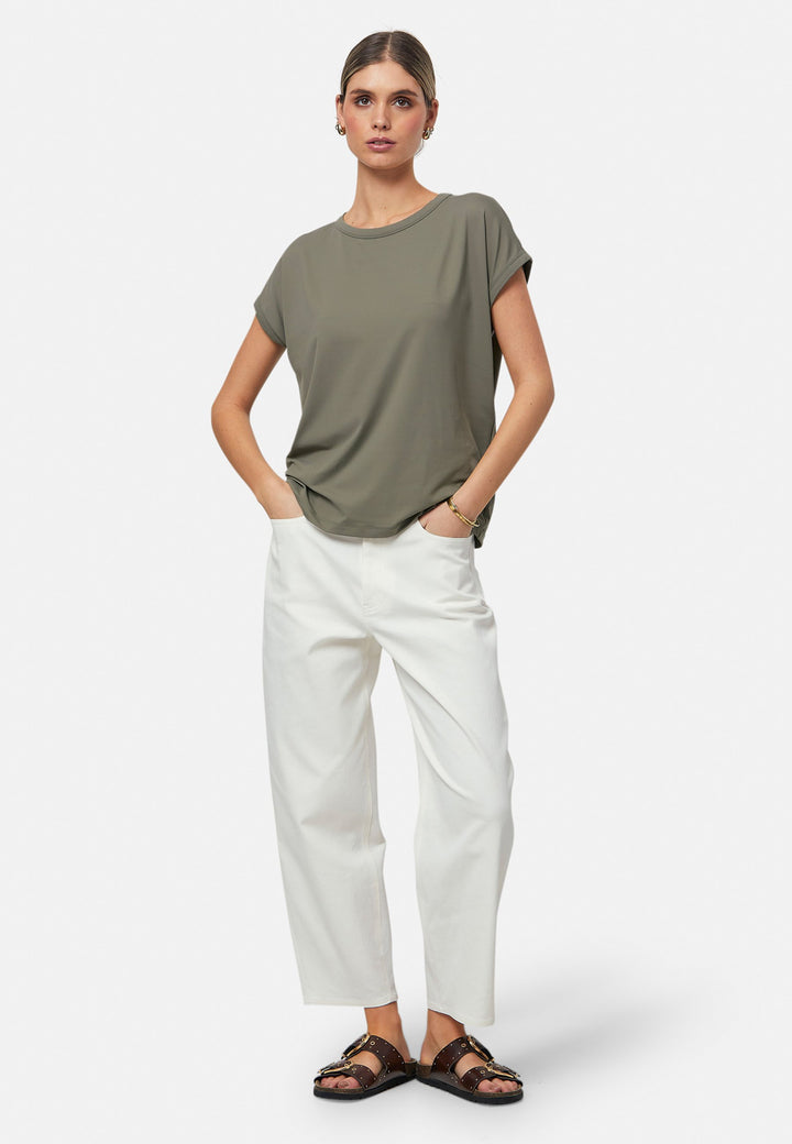Gina, a fluid T-shirt with a clean crew neck. This loose silhouette is made to be worn oversized. Fabricated in a luxe stretch jersey. This style features in our soft olive collection, pairing perfectly with our Lyra Pant and Cassie Jacket for a monochrome moment.