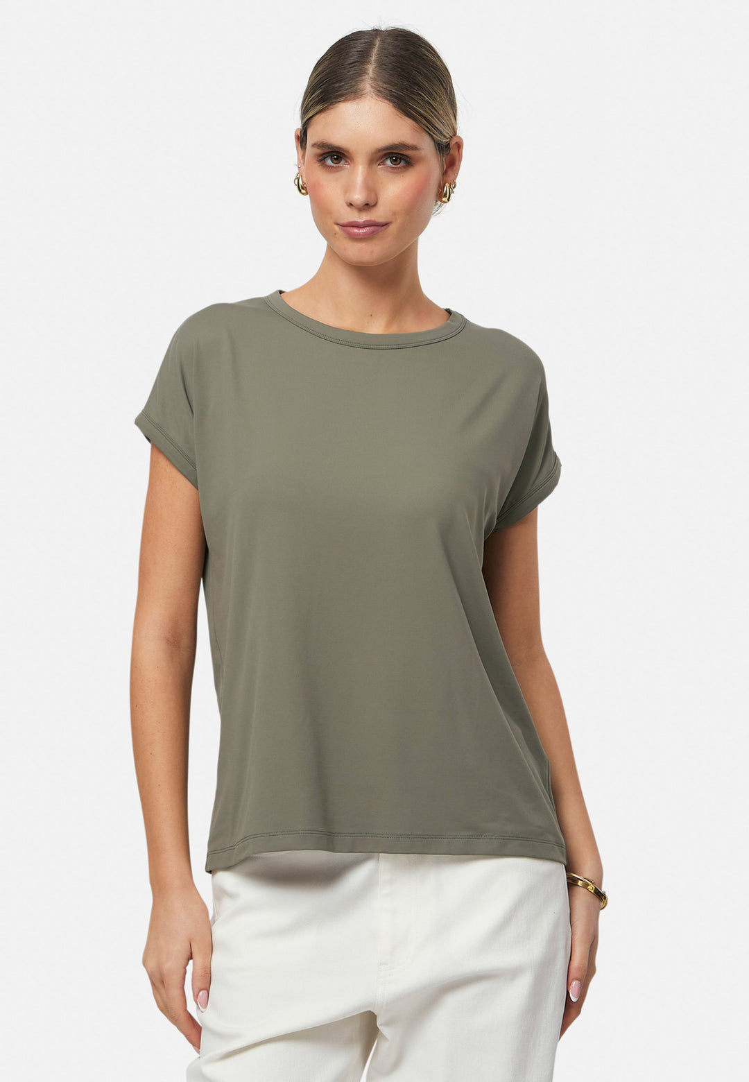 Gina, a fluid T-shirt with a clean crew neck. This loose silhouette is made to be worn oversized. Fabricated in a luxe stretch jersey. This style features in our soft olive collection, pairing perfectly with our Lyra Pant and Cassie Jacket for a monochrome moment.