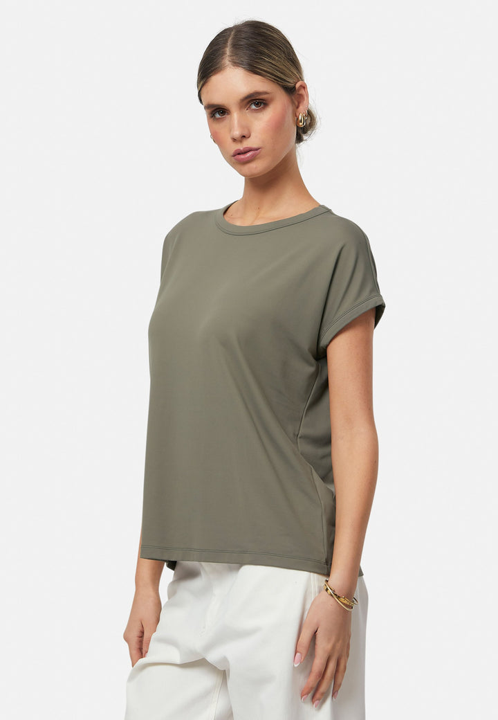 Gina, a fluid T-shirt with a clean crew neck. This loose silhouette is made to be worn oversized. Fabricated in a luxe stretch jersey. This style features in our soft olive collection, pairing perfectly with our Lyra Pant and Cassie Jacket for a monochrome moment.