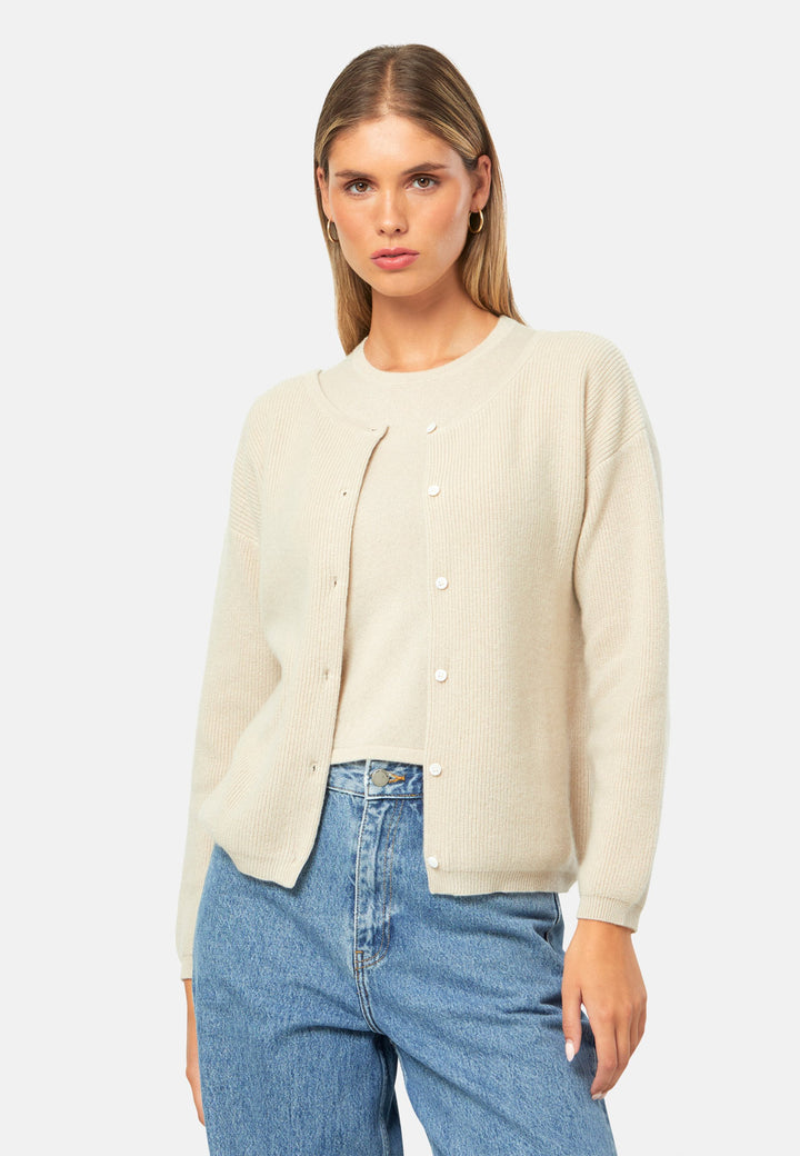 A versatile, reversible cardigan you can wear buttoned at the front or back, or pair with the matching Marlena top. Spun from pure cashmere with a plush, cloud-soft handle, it features a neat crew neckline, dropped shoulders and an easy, hip-skimming fit finished with fine rib trims.