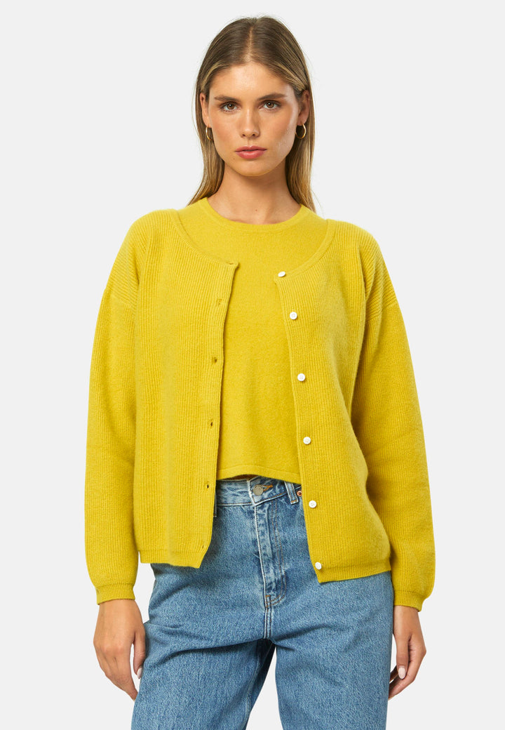 A versatile, reversible cardigan you can wear buttoned at the front or back, or pair with the matching Marlena top. Spun from pure cashmere with a plush, cloud-soft handle, it features a neat crew neckline, dropped shoulders and an easy, hip-skimming fit finished with fine rib trims.