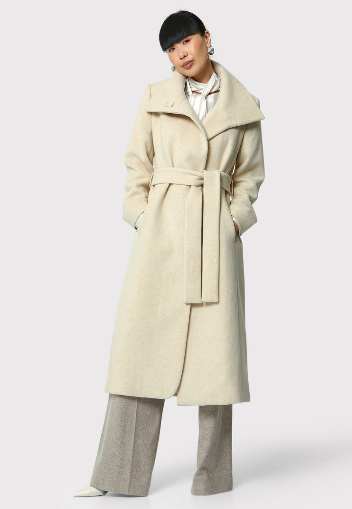 Stay warm and stylish with the Hazel Winter White Coat. Crafted from a luxurious wool blend melton, this coat features a large funnel which falls to a shawl collar and a belted waist for a flattering silhouette. Pair it with tailored trousers or a chic dress for a sophisticated winter look.