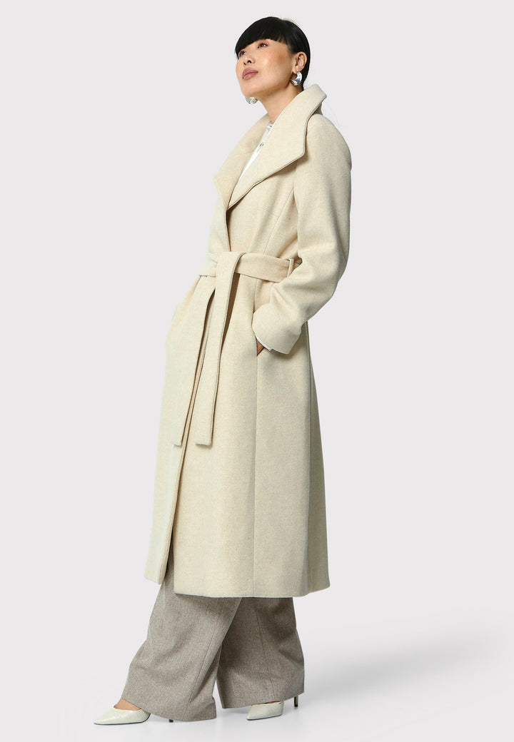 Stay warm and stylish with the Hazel Winter White Coat. Crafted from a luxurious wool blend melton, this coat features a large funnel which falls to a shawl collar and a belted waist for a flattering silhouette. Pair it with tailored trousers or a chic dress for a sophisticated winter look.