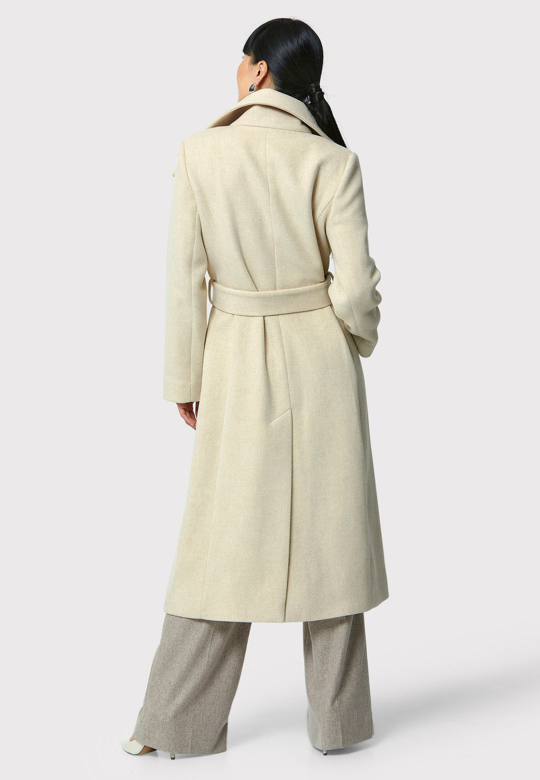 Stay warm and stylish with the Hazel Winter White Coat. Crafted from a luxurious wool blend melton, this coat features a large funnel which falls to a shawl collar and a belted waist for a flattering silhouette. Pair it with tailored trousers or a chic dress for a sophisticated winter look.