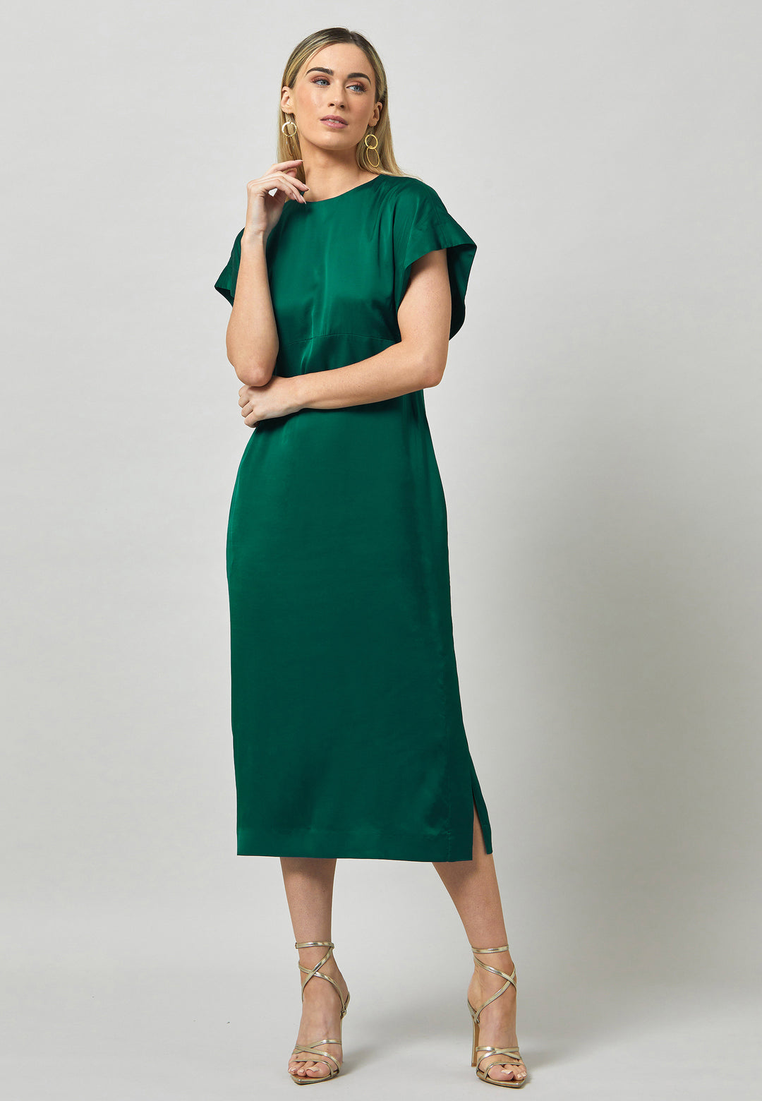 Evening edits get upgraded with the Shiv dress. Crafted in luxurious satin. An easy-fitting silhouette with a v-neckline. Skirt falls to the mid-calf and side seam slit adds a sense of allure. Features handy Side seam pockets. Engineered with an elegant key-hole back neck detail. Simply add heels and a clutch for a look that turns heads at any event. Classic Occasionwear, modernized.