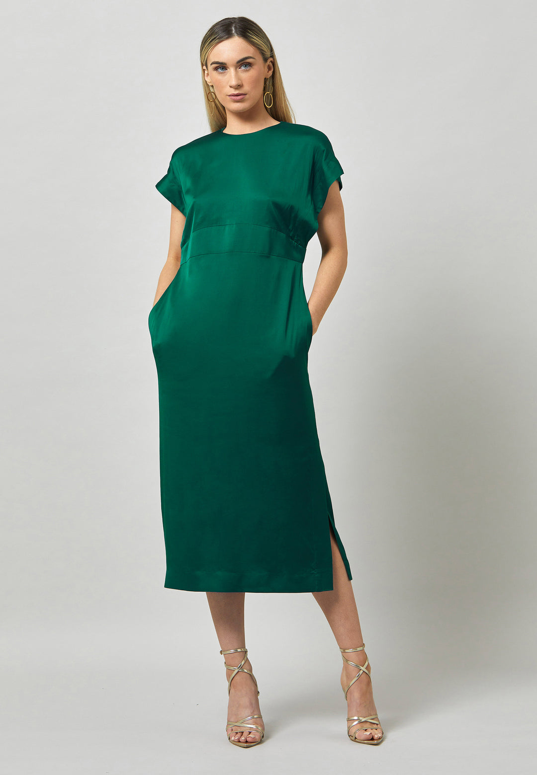 Evening edits get upgraded with the Shiv dress. Crafted in luxurious satin. An easy-fitting silhouette with a v-neckline. Skirt falls to the mid-calf and side seam slit adds a sense of allure. Features handy Side seam pockets. Engineered with an elegant key-hole back neck detail. Simply add heels and a clutch for a look that turns heads at any event. Classic Occasionwear, modernized.