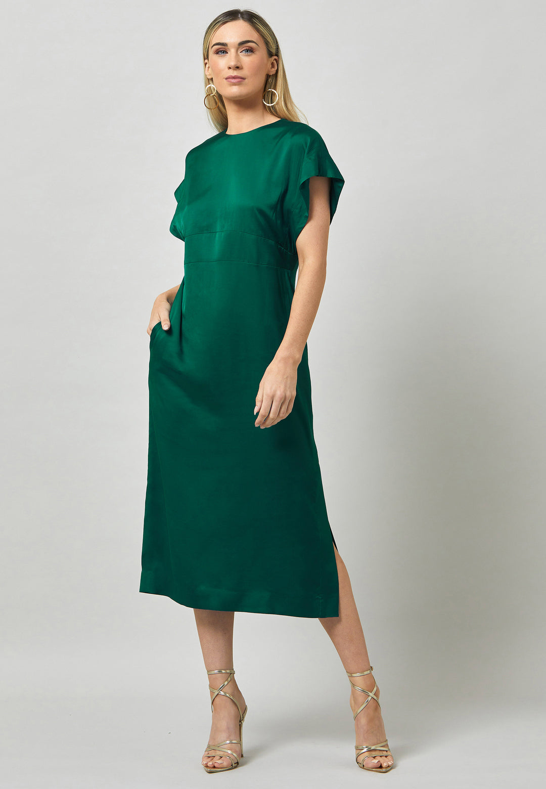 Evening edits get upgraded with the Shiv dress. Crafted in luxurious satin. An easy-fitting silhouette with a v-neckline. Skirt falls to the mid-calf and side seam slit adds a sense of allure. Features handy Side seam pockets. Engineered with an elegant key-hole back neck detail. Simply add heels and a clutch for a look that turns heads at any event. Classic Occasionwear, modernized.