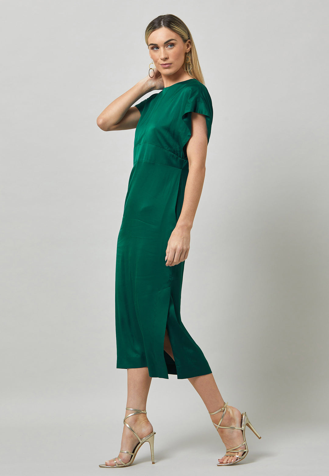 Evening edits get upgraded with the Shiv dress. Crafted in luxurious satin. An easy-fitting silhouette with a v-neckline. Skirt falls to the mid-calf and side seam slit adds a sense of allure. Features handy Side seam pockets. Engineered with an elegant key-hole back neck detail. Simply add heels and a clutch for a look that turns heads at any event. Classic Occasionwear, modernized.