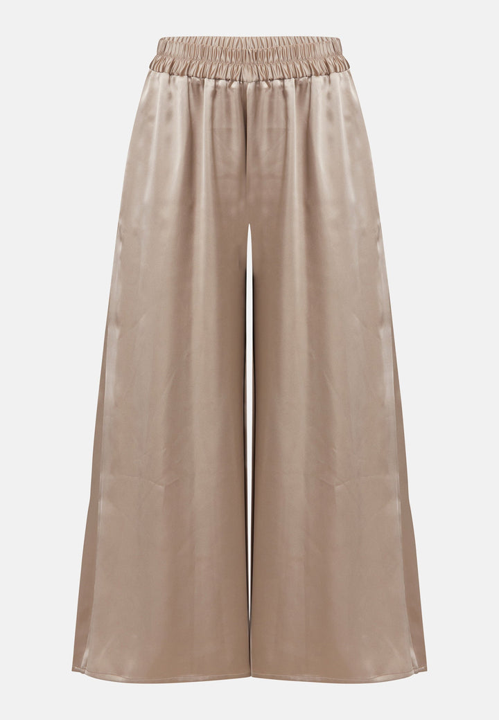 The Imogen Coffee trousers bring chic comfort and versatility to your wardrobe. With a flowing wide leg that elegantly falls to the ankle. These trousers prioritize comfort with an elasticated gathered waistband. Pair this bestselling silhouette with our Berna Coffee top for an elegant co-ord look.