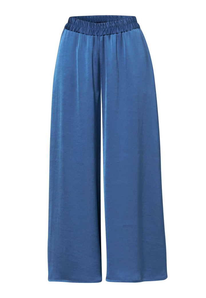 Woman wearing silk-touch satin in storm blue pants