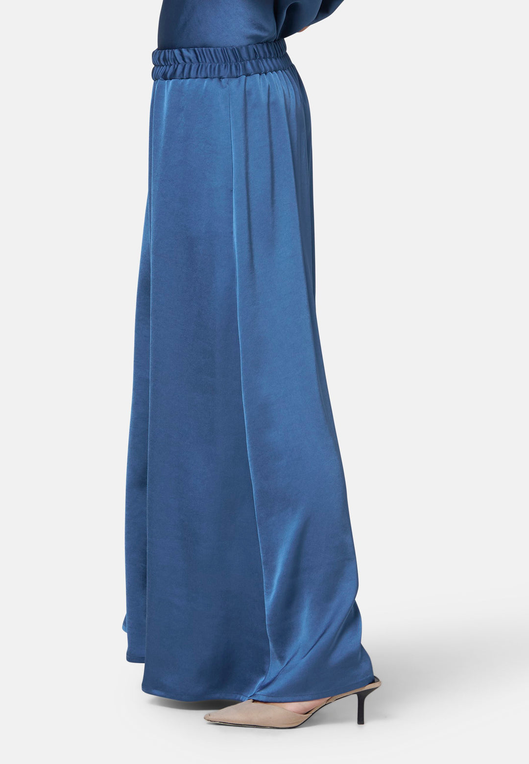 Woman wearing silk-touch satin in storm blue pants