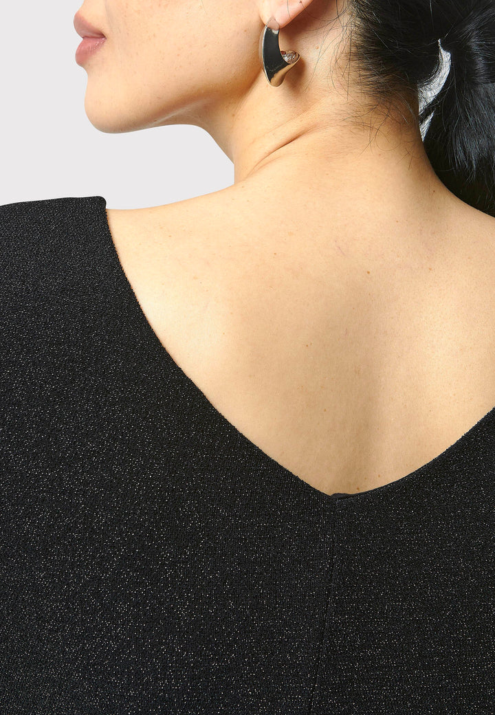 Introducing the Jamie Black Shimmer Dress, an elegant bodycon piece with full-length sleeves. Made from sparkly black jersey fabric, it features a slash neck with a slight V-back for added allure. Its midi length perfectly balances classic and modern styles. Ideal for any occasion, this dress adds a touch of glamour to your look.